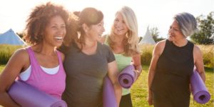 Diverse group of women leaving yoga practice